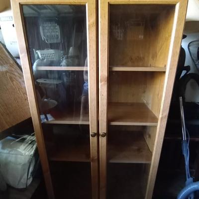 LOT 48 THREE SHELF WOODEN GLASS FRONT CABINET
