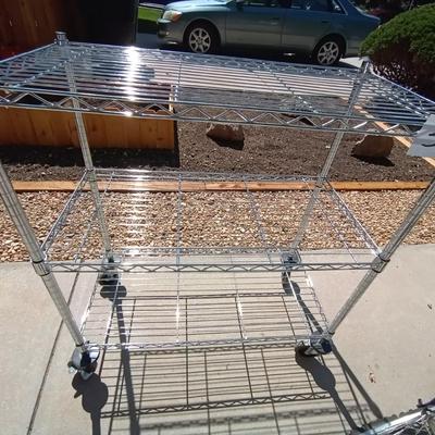 LOT 39 TWO SHELF ROLLING WIRE RACK