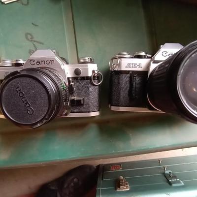 LOT 125 TWO CANON CAMERAS AND LENS