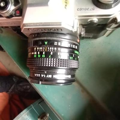 LOT 125 TWO CANON CAMERAS AND LENS