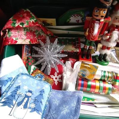 LOT 114 TWO NUTCRACKERS AND CONTAINER FULL OF WRAPPING SUPPLIES
