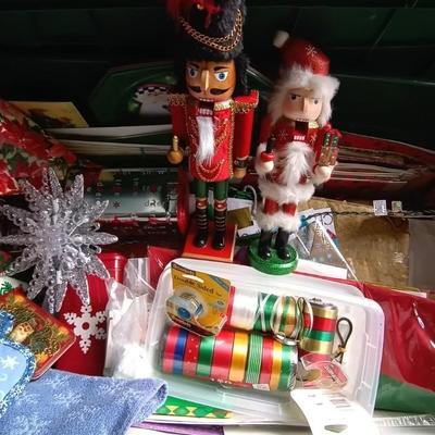 LOT 114 TWO NUTCRACKERS AND CONTAINER FULL OF WRAPPING SUPPLIES