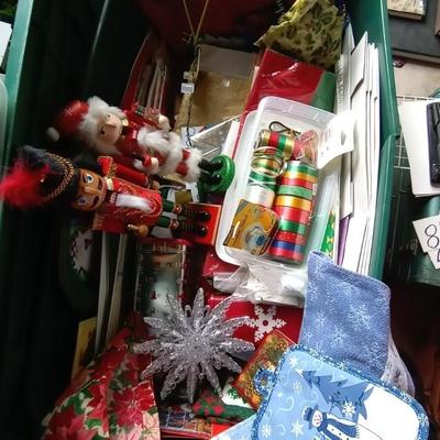 LOT 114 TWO NUTCRACKERS AND CONTAINER FULL OF WRAPPING SUPPLIES
