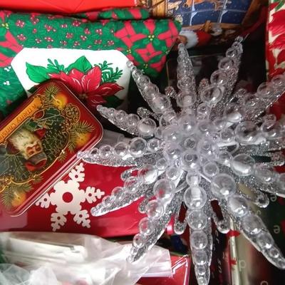 LOT 114 TWO NUTCRACKERS AND CONTAINER FULL OF WRAPPING SUPPLIES
