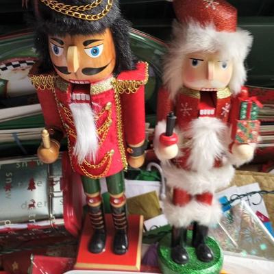 LOT 114 TWO NUTCRACKERS AND CONTAINER FULL OF WRAPPING SUPPLIES
