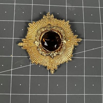 Gold Toned Sun Dial Shape with large Topaz Pin