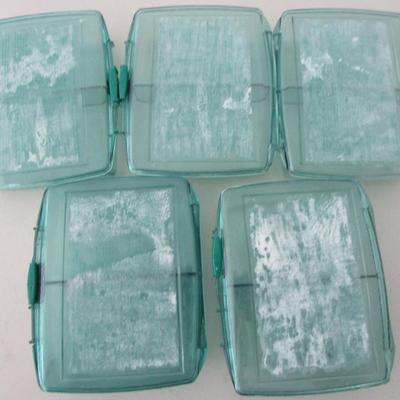 #42 Five small green plastic organizer boxes