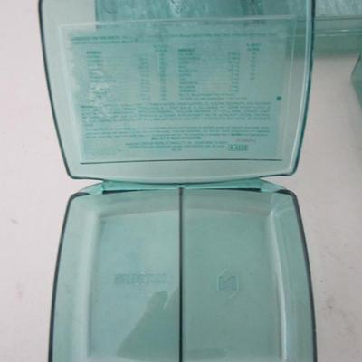 #42 Five small green plastic organizer boxes