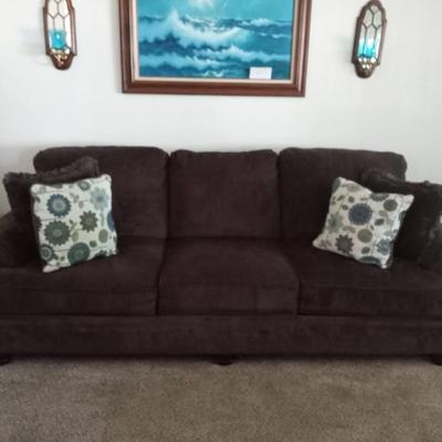 LOT 10  DARK BROWN SOFA WITH THROW PILLOWS  (Front room)