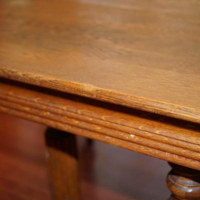 EARLY 1900'S SQUARE  OAK TABLE W/TWO LEAVES/FLUTED LEGS/ CENTER LEG SUPPORT