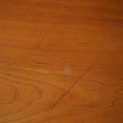 19th CENTURY CHERRY & FLAME MAHOGANY THREE DRAWER BUREAU W/ DROP LEAF SIDES