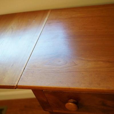 19th CENTURY CHERRY & FLAME MAHOGANY THREE DRAWER BUREAU W/ DROP LEAF SIDES