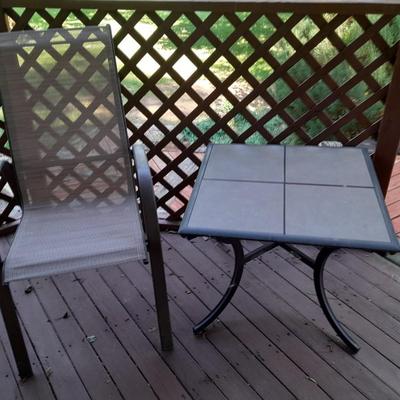 LOT 27 TWO PATIO CHAIRS AND A TILE TOP TABLE