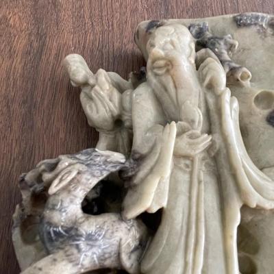 Asian stone carving - tending to the flock