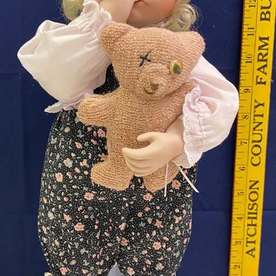 Baby Sucking Her Thumb with a Bear