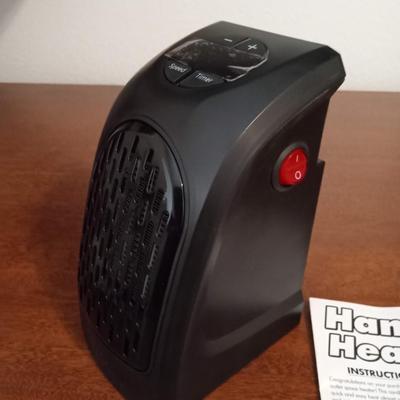 LOT 125  HANDY HEATER AND BATTERY OPERATED PERSONAL FAN
