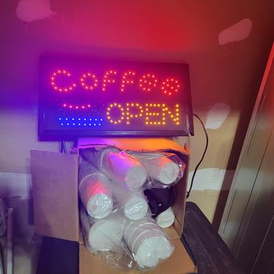 lighted open sign, coffee cups
