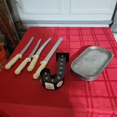 Knives, sizzle plates, letter J