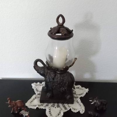 LOT 19 ELEPHANT CANDLE HOLDER WITH 4 SMALL ELEPHANTS  (Front room)