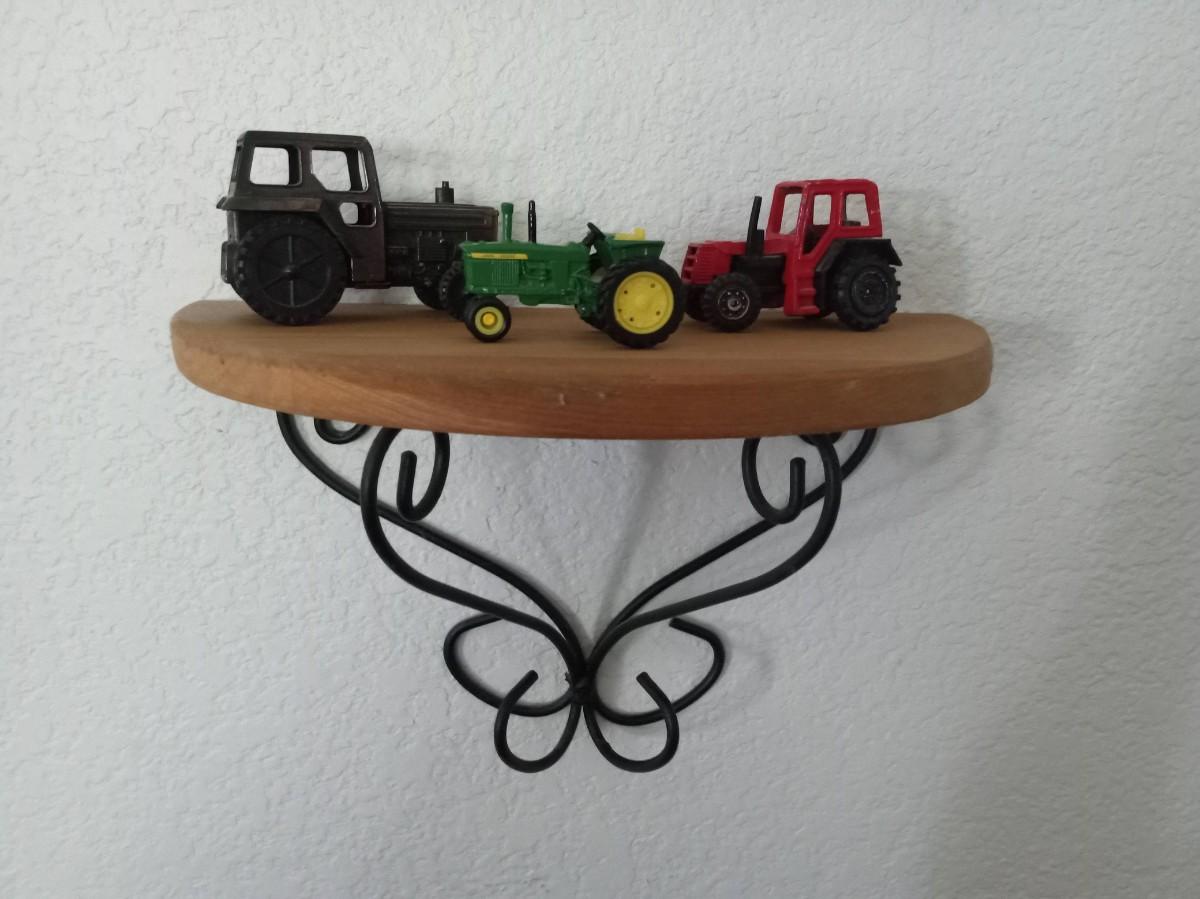 LOT 20 SMALLER TOY METAL TRACTORS, WALL SHELF AND A PICTURE OF A JOHN
