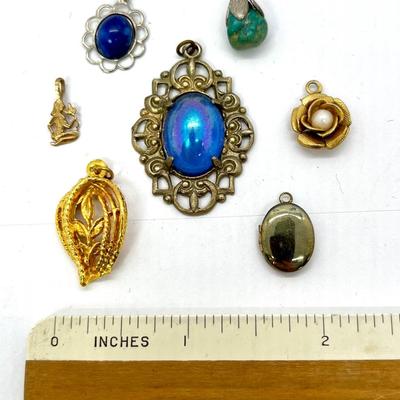 Lot of seven pendants blue green golden