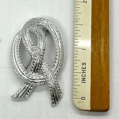 Silver looped knot pin