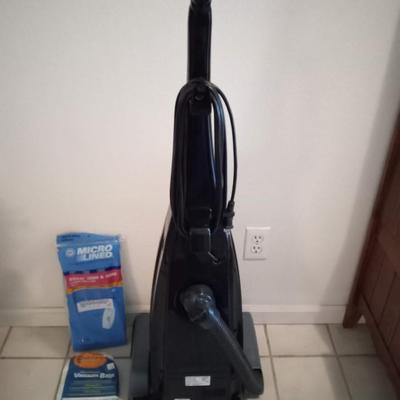 LOT 4  RICCAR VACUUM CLEANER WITH EXTRA BAGS (Entry way closet)