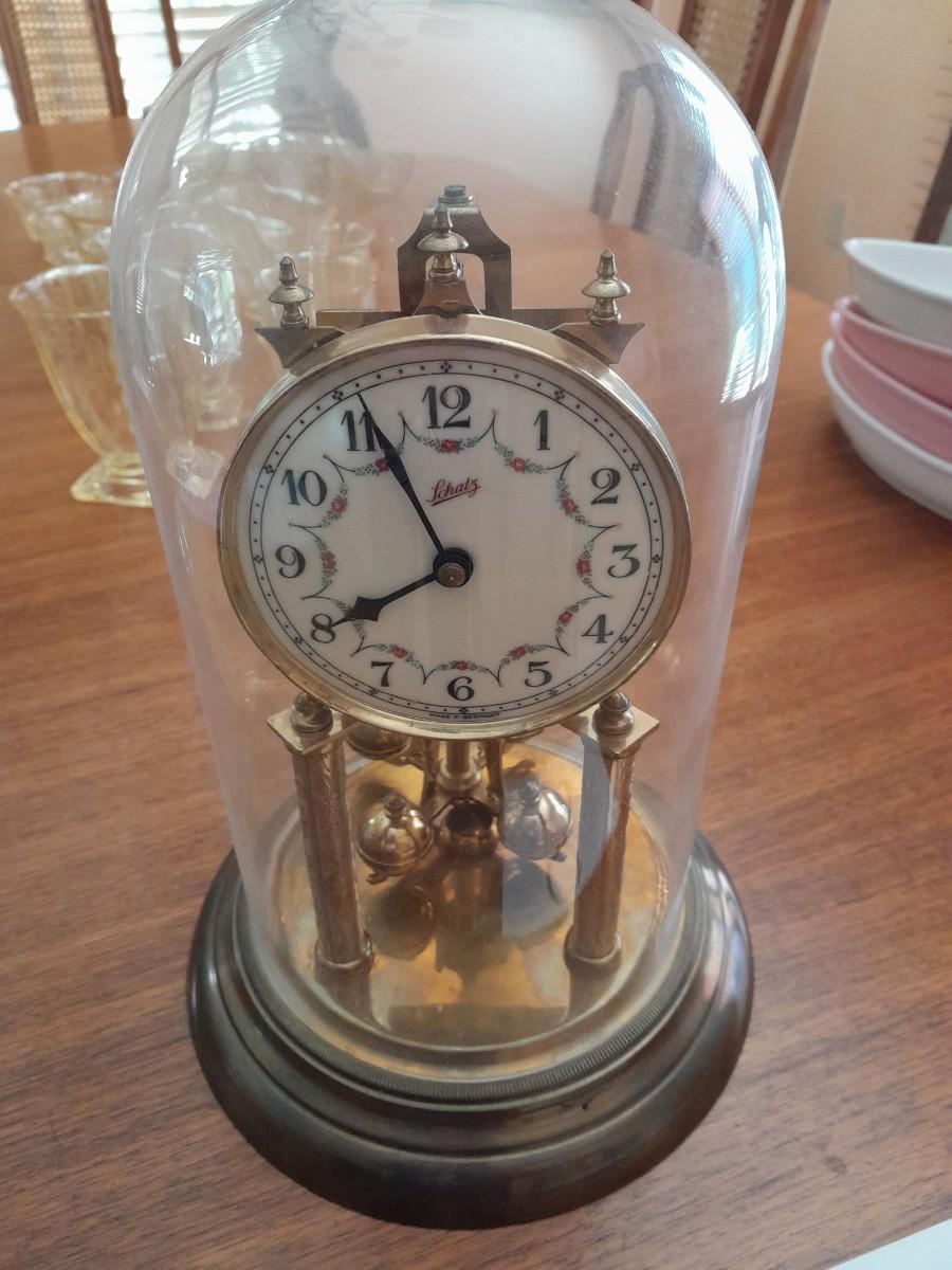 LOT 431 SCHATZ GERMAN BRASS CLOCK WITH GLASS DOME AND TORSIONAL