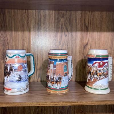 LOT 41 THREE COLLECTIBLE BUDWEISER STEINS FROM 1996, I 997, 1998