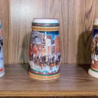LOT 41 THREE COLLECTIBLE BUDWEISER STEINS FROM 1996, I 997, 1998
