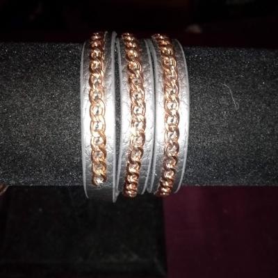 LOT 28  TWO LEATHER MULTI BAND BRACELETS WITHACCENTS