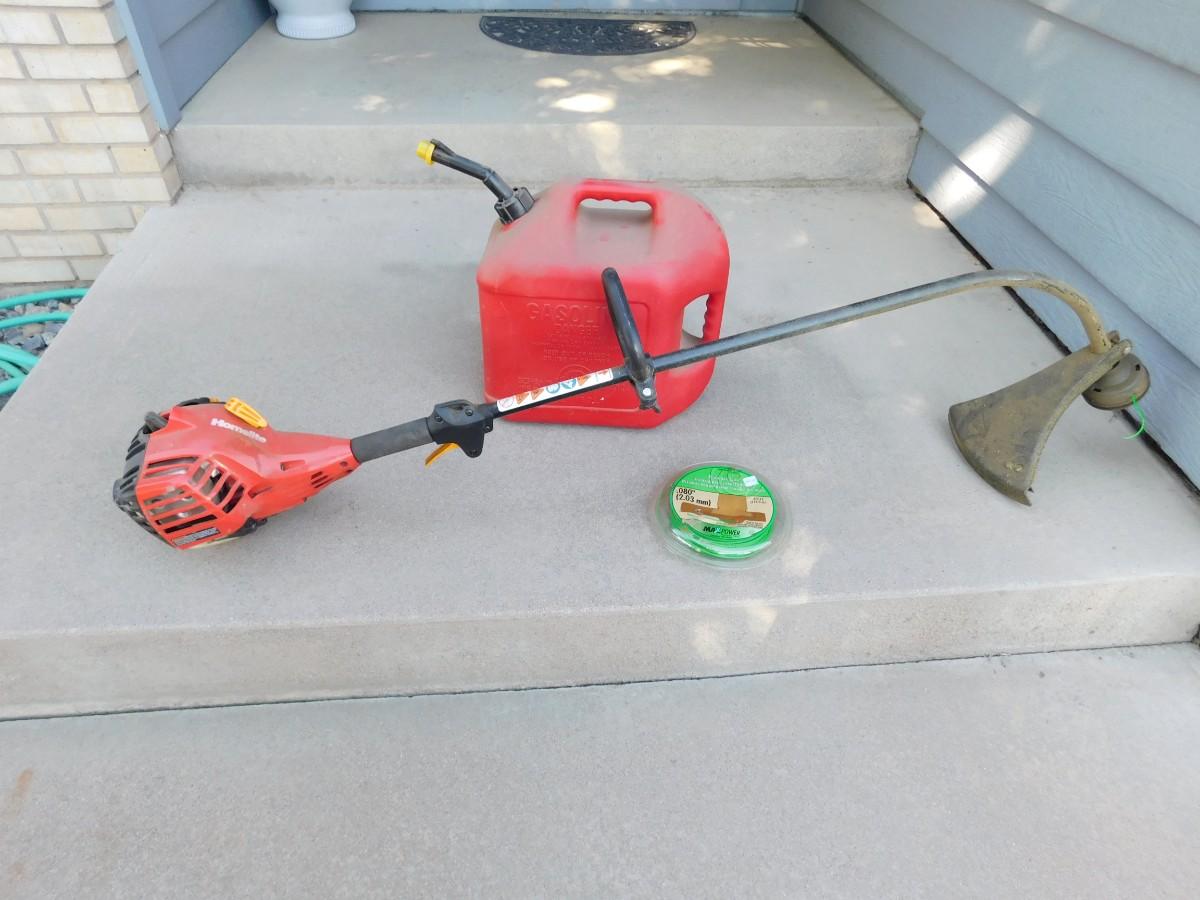 LOT 263 HOMELITE GAS WEED EATER, 5 GAL GAS CAN, AND TRIMMER STRING