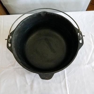 Vintage cast iron stew pot with lid