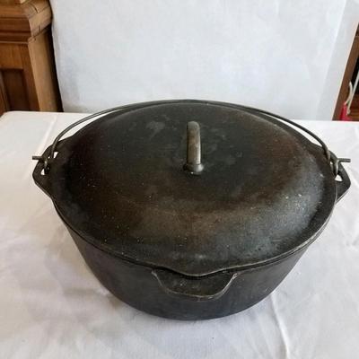 Vintage cast iron stew pot with lid