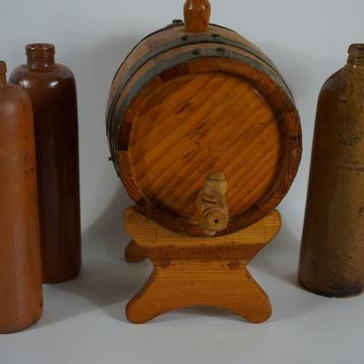 SMALL WOODEN BARRELL W/ THREE STONEWARE BOTTLES GROUPING.