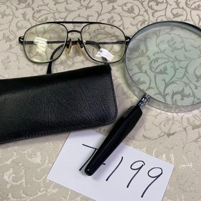 Glasses and magnifying glass
