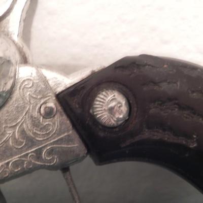 TWO VINTAGE CAPGUNS IN HOLSTERS