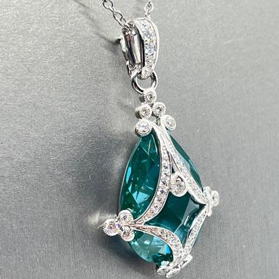 LOT 202: Erica Courtney Diamonique 22 ct tw Sterling Silver Aqua Tormaline Enhancer/Pendant on 20" Chain