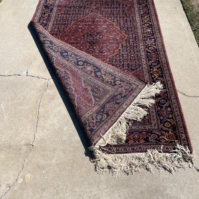 LOT 56   HAND KNOTTED PERSIAN RUG DARK COLORS