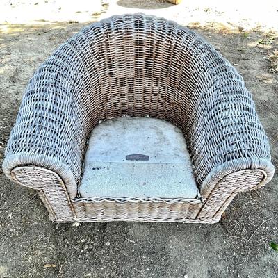 LOT D  OVER SIZE WEATHERED WICKER HORSESHOE COLLAR LAWN CHAIR.