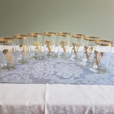 Set of 8 MCM bar glasses trimmed in gold