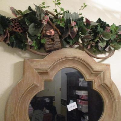 Wood-framed Mirror and Decorative Floral Overhang