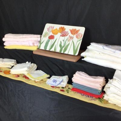 Lot. 6223. Assorted linens, placemats and needlepoint wall hanging