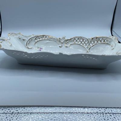 Antique German porcelain pierced handled bowl with handles