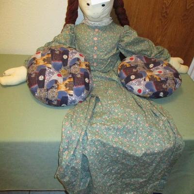 Doll with two pillows