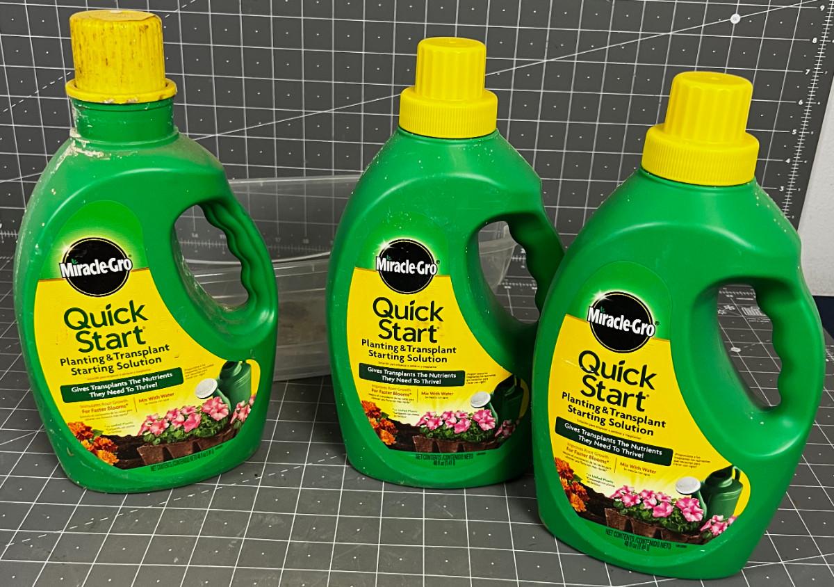3 jugs of Miracle Gro Quick Start Solution
