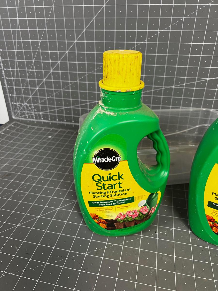3 jugs of Miracle Gro Quick Start Solution