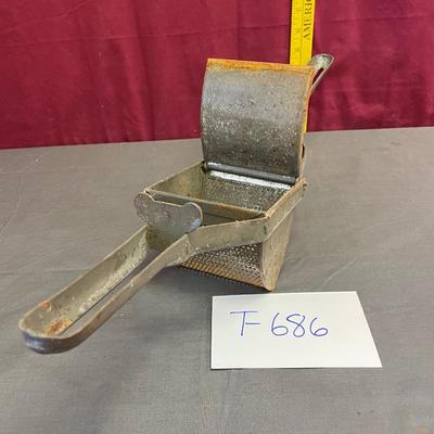 He is press rustic potato masher