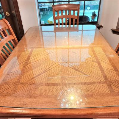 Lot #107  Casual Contemporary Oak Dining Room Set w/tempered glass protective top & leaf