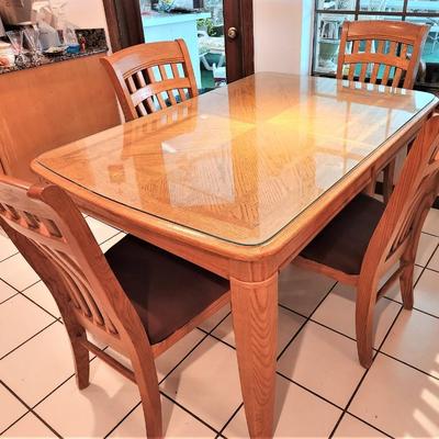 Lot #107  Casual Contemporary Oak Dining Room Set w/tempered glass protective top & leaf